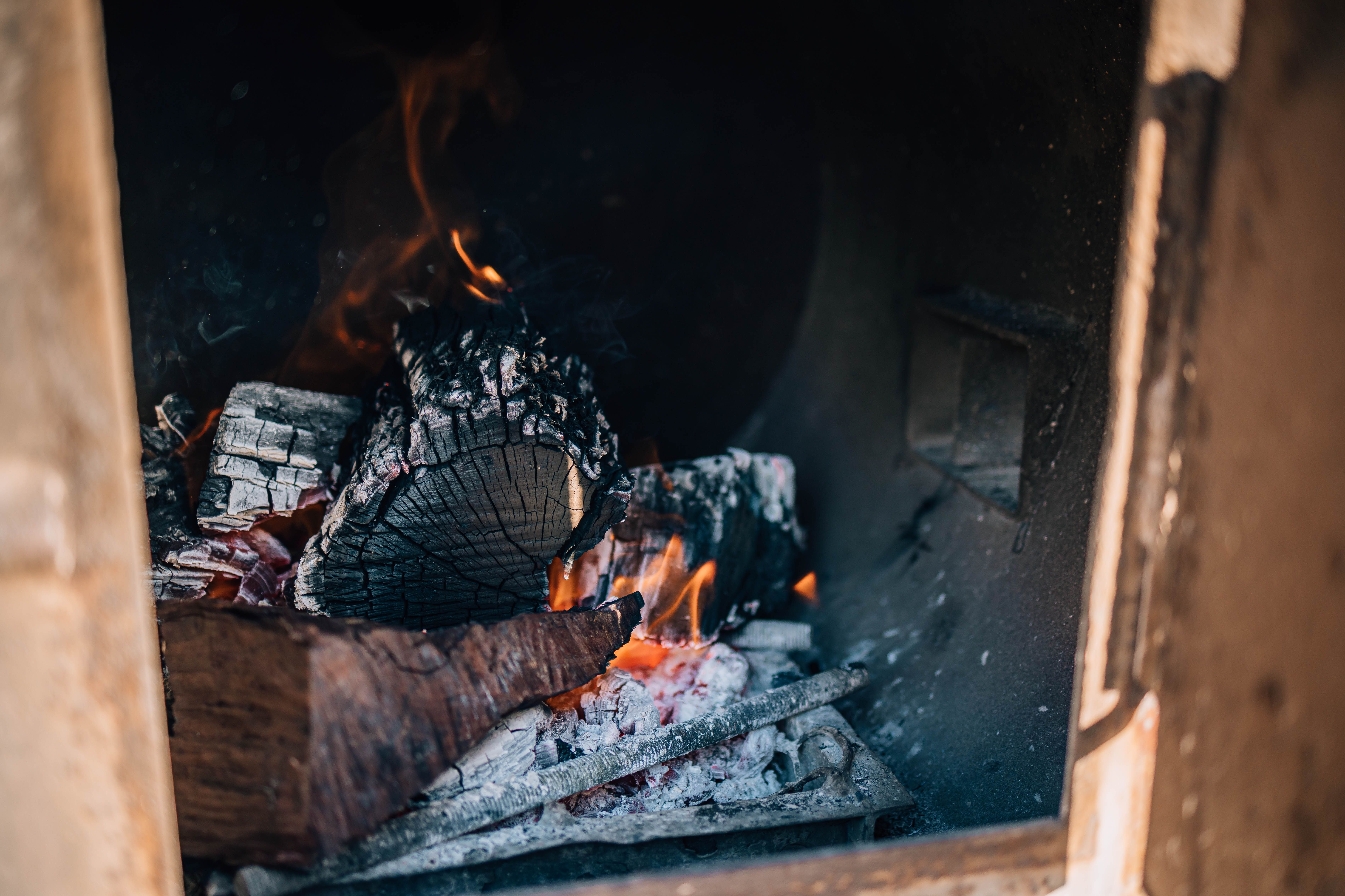 The Holy Smoke Bonaire custom-built smoker in action with hardwood smoke